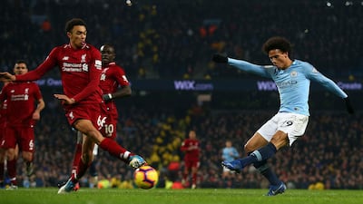 Manchester City's Leroy Sane, right, shoots to score his side's second goal during the English Premier League soccer match. AP