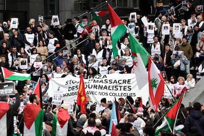 Protesters at a demonstration in support of Palestinian journalists, in front of the Opera Bastille in Paris. AFP