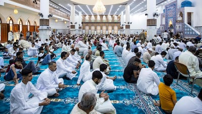 Iraqis offer prayers on Friday morning, the first day of Eid, at the Basra Grand Mosque. AFP