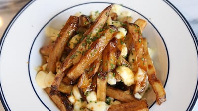 DUBAI , UNITED ARAB EMIRATES – June 23 , 2016 : Poutine dish at the Maine restaurant at the Doubletree by Hilton hotel in JBR in Dubai. ( Pawan Singh / The National ) For Arts & Life. Story by Ann Marie McQueen. ID no : 95338