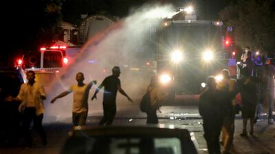 Israeli police fire water cannon during tensions in the Sheikh Jarrah neighbourhood. Reuters
