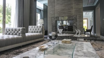 The formal living room. For the right price, property broker Luxhabitat says the seller will also throw in a Range Rover, a Porsche and a Rolls-Royce Ghost. There are 189 villas in Al Barari and most of them are valued at between Dh15m and Dh15.5m. But there are a handful of trophy villas. Mona Al Marzooqi / The National