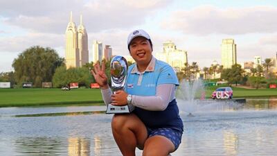 Shanshan Feng poses with the trophy after winning the Dubai Ladies Masters. Nezar Belout / AFP