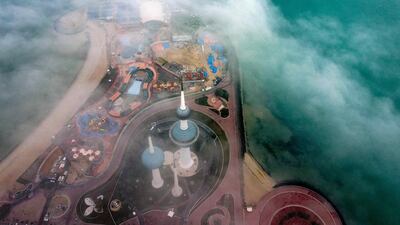 Kuwait Towers on a foggy morning in Kuwait City. AFP