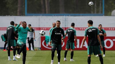 Cristiano Ronaldo, centre, and his teammates attend a training session in Kratovo, Moscow, Russia on June 12, 2018. Maxim Shemetov / Reuters