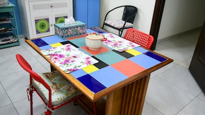 Alam made a table using scrap wood and leftover tiles