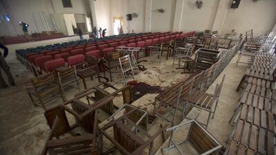 A view of the Army Public School auditorium the day after Taliban gunmen stormed the school in Peshawar, Pakistan, last year. BK Bangash / AP Photo