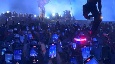 A man stands on an ambulance. Reuters