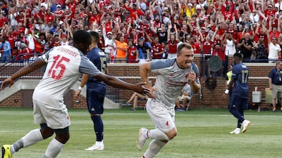 Liverpool 's Xherdan Shaqiri celebrates after scoring. AFP