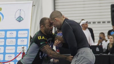 Paulo Pinto, left, and Wagner Ribeiro lock heads in the No Gi black belt 108-kilogram final in the Armed Forces Officers Club Ramadan Cup on Saturday, June 10, 2017. Amith Passela / The National