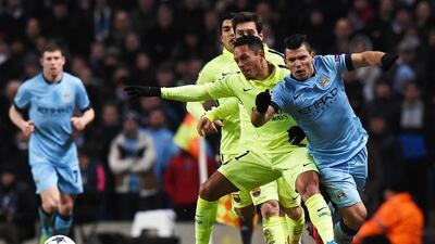 Barcelona's Adriano fouls Manchester City's Sergio Aguero during their first leg at the Etihad Stadium on February 24, 2015. Paul Ellis / AFP