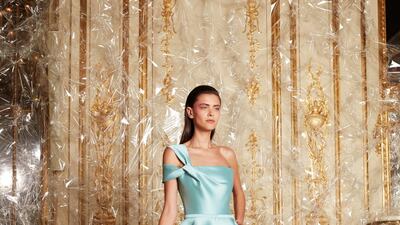 An architectural mint green duchesse satin dres