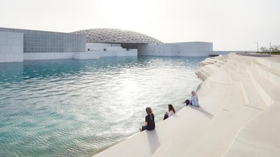 People sit by the Louvre in Abu Dhabi. DCT Abu Dhabi