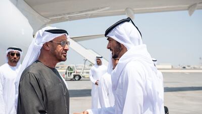 President Sheikh Mohamed greets Sheikh Khalifa bin Hamad bin Khalifa Al Thani, Minister of the Interior of Qatar, on arrival at Doha International Airport. Abdulla Al Neyadi / UAE Presidential Court