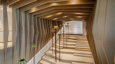 Staircase Art: Khalid Shafar's palm tree sculptures enrich the staircase from the ground to the first floor, blending natural inspiration with modern design. Photo: Roar Design Studio