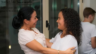 A pupil at Jumeirah English Speaking School in Arabian Ranches celebrates as she receives her IB test results. Navin Khianey for The National