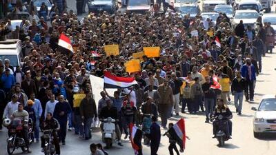 The refusal of President Hosni Mubarak to step down, and the army's pledge to carry out the reforms promised by the regime to end weeks of protests, fail to appease demonstrators. Above, anti-government protesters march through a street in Cairo.
