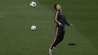 Cristiano Ronaldo practices heading the ball at Real Madrid's training session on Tuesday. Andres Kudacki / AP / April 1, 2014