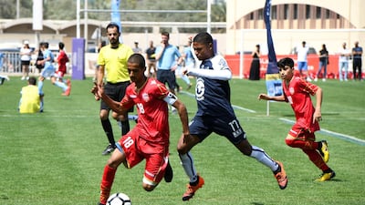 Bahrain National team (red) vs. Legends soccer team from South Africa (white/blue) under 14 age group.