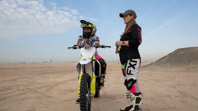 Michelle Christie and Sandra Blaskovic take a break between rides with the Dubai skyline far in the distance