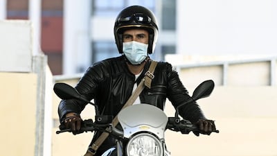 Maradona's personal physician Leopoldo Luque leaves the clinic where Maradona underwent brain surgery. AFP