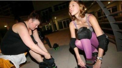 Dani Connell (left) and Susan Strickland puts on their skates during the roller derby group meeting at Jumeirah Lake Towers. Jaime Puebla/The National