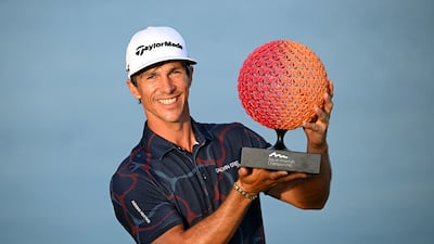 Thorbjorn Olesen of Denmark celebrates with the trophy after his six-shot victory in the Ras Al Khaimah Championship at Al Hamra Golf Club on January 28, 2024. Getty Images