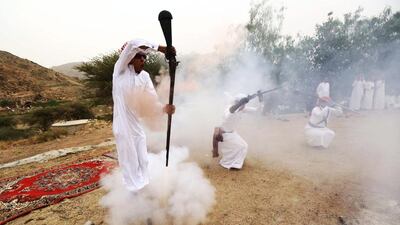 Saudi men celebrate in a bedouin display of skills, with muskets - or jezail- loaded only with gunpowder. Mohamed Al Hwaity / Reuters