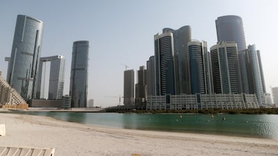 Abu Dhabi, United Arab Emirates, August 12, 2015: General view of the Shams development complex on Al Reem Island in Abu Dhabi on August 12, 2015. Shown from left to right, Shams development with the Sun Tower far left, The Gate Towers, Sky Tower and Hydra Avenue, the City of Lights (not open yet) far right. Christopher Pike / The National Reporter: N/A Section: Business *** Local Caption *** CP0812-bz-STOCK-Shams16.JPG