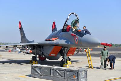Indian Air Force personnel service a Russian-made MiG-29 fighter jet at the Yelahanka Air Force Station in the southern city of Bengaluru. AFP