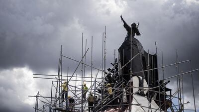 Workers dismantle the scaffolding around the People Power monument in Manila after removing the rust and polishing ahead of the 32nd People Power Revolution anniversary on February 25. A popular People Power revolt toppled Ferdinand Marcos from power in 1986 and chased him into exile in Hawaii, where he died in 1989. Noel Celis / AFP