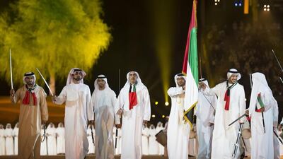 Lt Genl Sheikh Saif bin Zayed, Deputy Prime Minister and Minister of Interior (4th L) dances at the end of the 44th UAE National Day celebrations held at Zayed Sports City. Seen with Sheikh Ammar bin Humaid, Crown Prince of Ajman (2nd L), Sheikh Abdullah bin Zayed, Minister of Foreign Affairs (2nd R) and other dignitaries. Mohamed Al Suwaidi / Crown Prince Court - Abu Dhabi