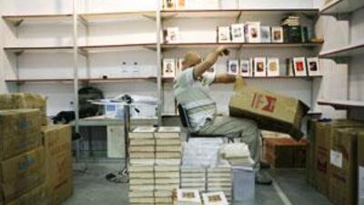 Mazen Assaf of Lebanon packs up books from the Arab Network for Research and Publishing on the last night of the Abu Dhabi International Book Fair.