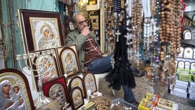 Shop owners near the Church of the Holy Sepulchre in the Old City of Jerusalem.
