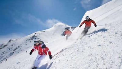 Visitors enjoy summer skiing on the slopes of Kitzsteinhorn glacier near Salzburg, Austria.