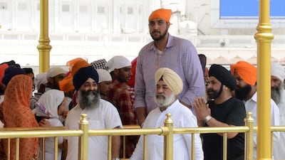 NBA player Sim Bhullar shown during a tour of India at the Golden Temple in Amritsar on May 5, 2015. Narinder Nanu / AFP