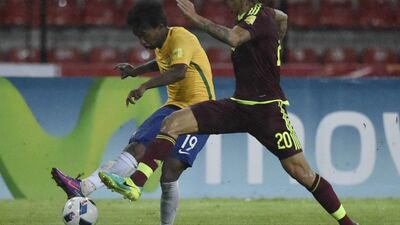 Brazil midfielder Willian shapes to shoot. Juan Barreto / AFP