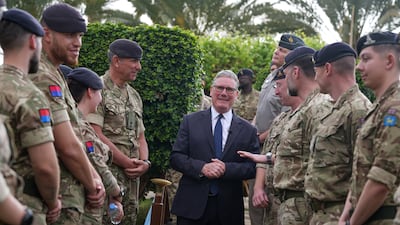 Mr Starmer meets aircrew members during a visit to Taif Airbase in Saudi Arabia in April. Getty Images