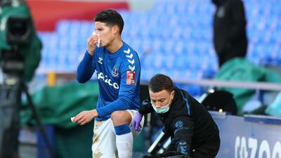 Everton's James Rodriguez after taking a ball in the face. PA