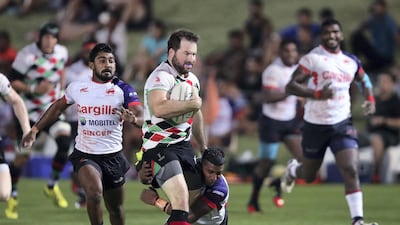 Quins' Tom Southall makes a break against Kandy. Chris Whiteoak / The National