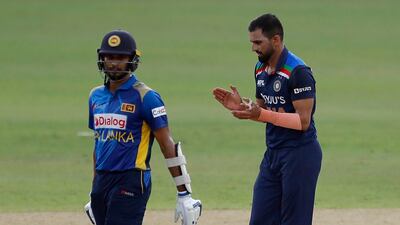 India's bowler Deepak Chahar, right, celebrates taking the wicket of Sri Lanka's Wanidu Hasaranga.