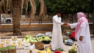 A street vendor sells fruit and vegetables on a roadside in Riyadh. Bloomberg