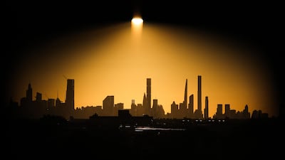 The Manhattan skyline is seen at sunset from Louis Armstrong Stadium during the US Open tennis tournament. AFP