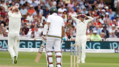 England's Joe Root, right, and Ben Stokes, left, react as South Africa's Hashim Amla stands at his crease.