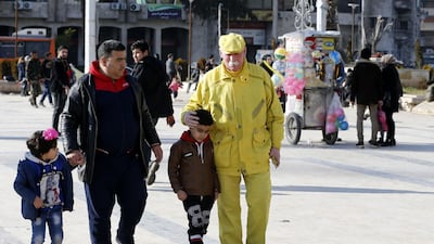 Zakkour walks along with pedestrians in the central square