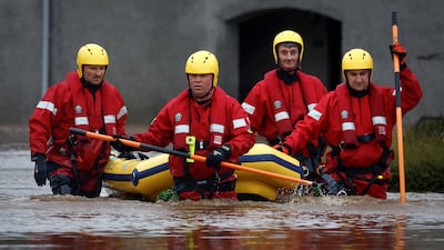 Emergency services rescuing people from the floods. Getty Images
