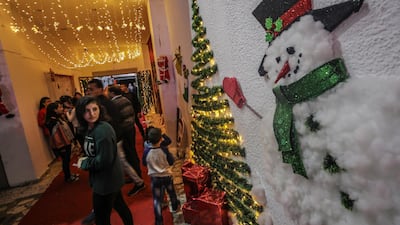 Twinkling lights and snowman decorations make the Christmas tree lighting all the more special. EPA