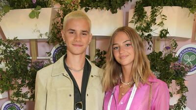 Romeo Beckham and Mia Regan pose in Evian's VIP suite during day one of The Championships, Wimbledon 2021.