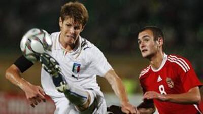 Italy's Michelangelo Albertazzi, left, clears the ball ahead of Hungary's Andras Simon in Friday night.