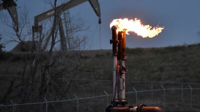 A flare to burn methane from oil production near Watford City, North Dakota. The oil and gas industry's Cop28 methane pledge has been praised, but concerns linger about its implementation. AP